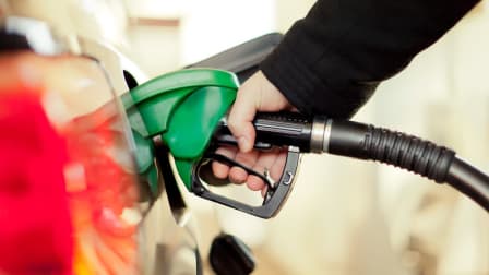 A person pumping gas