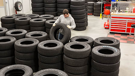 CR’s Tire Program Manager Ryan Pszczolkowski inspects tires at the Auto Test Center.